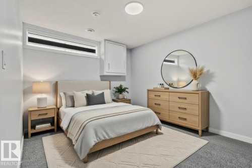 The property features a bedroom with light gray walls and carpeting, offering a neutral palette - 8620 38A Avenue, Edmonton, AB - Indoor Photo Showing Bedroom