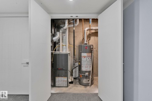 Utility closet featuring a water heater and furnace - 8620 38A Avenue, Edmonton, AB - Indoor