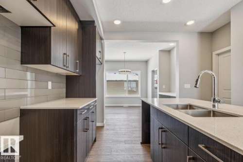 306 Hawthorn Way, Leduc, AB - Indoor Photo Showing Kitchen With Double Sink
