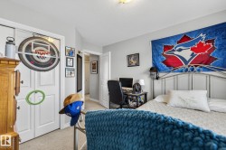 This room features light-colored walls and carpeted flooring - 