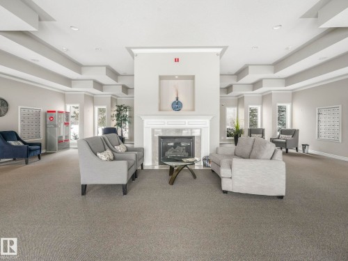 111 9535 176 Street, Edmonton, AB - Indoor Photo Showing Other Room With Fireplace