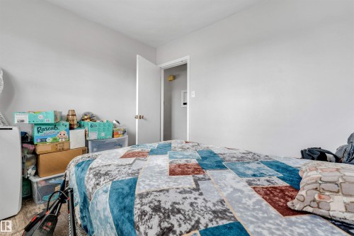 The property features light gray walls and a light-colored floor - 12908 126 Street, Edmonton, AB - Indoor Photo Showing Bedroom
