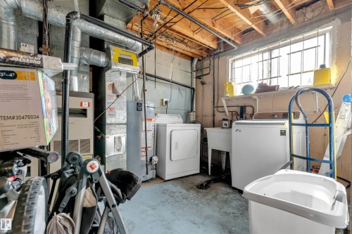 Utility area with exposed ceiling beams and a window - 12908 126 Street, Edmonton, AB - Indoor Photo Showing Laundry Room