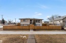 The property features a wood fence and a concrete walkway leading to the entrance - 12908 126 Street, Edmonton, AB  - Outdoor 