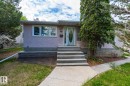 The property features a stucco exterior with a stone-accented foundation - 11815 76 Avenue, Edmonton, AB  - Outdoor 