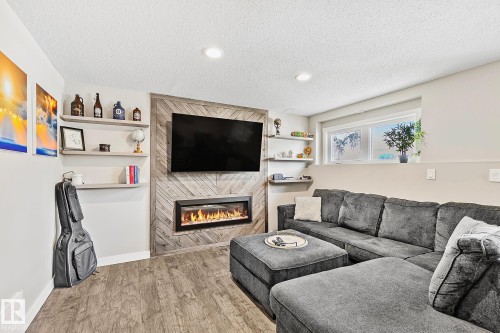 7720 158 Street, Edmonton, AB - Indoor Photo Showing Living Room With Fireplace