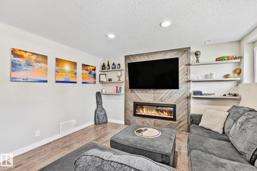 7720 158 Street, Edmonton, AB - Indoor Photo Showing Living Room With Fireplace