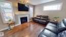 3885 Gallinger Loop, Edmonton, AB  - Indoor Photo Showing Living Room With Fireplace 