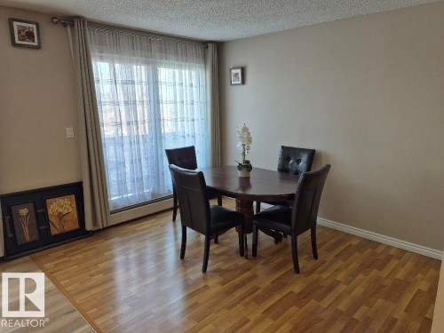 402 9323 105 Ave, Edmonton, AB - Indoor Photo Showing Dining Room With Fireplace