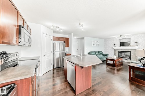 6003 48 Avenue, Beaumont, AB - Indoor Photo Showing Kitchen With Fireplace With Double Sink