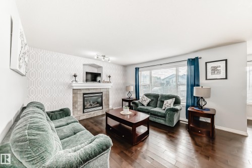 6003 48 Avenue, Beaumont, AB - Indoor Photo Showing Living Room With Fireplace