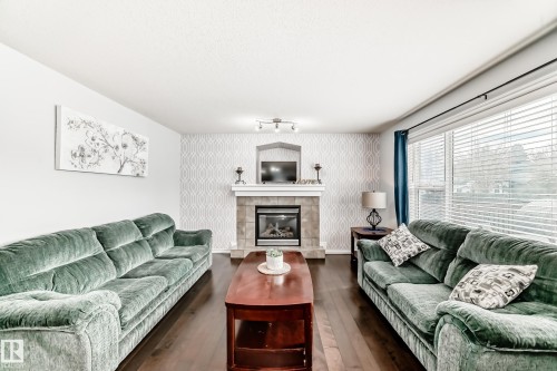 6003 48 Avenue, Beaumont, AB - Indoor Photo Showing Living Room With Fireplace