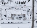 Aerial view of the property and surrounding area, featuring a large parking area and courtyard - 401 3611 145 Avenue, Edmonton, AB  - Other 