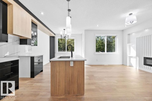 207 39 Avenue, Edmonton, AB - Indoor Photo Showing Kitchen With Fireplace