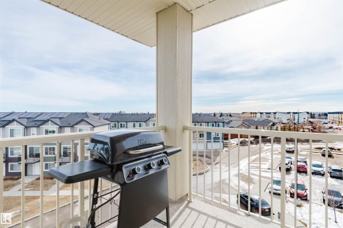 This property includes a balcony with a white railing and a concrete floor - 402 3670 139 Avenue, Edmonton, AB - Outdoor With Balcony