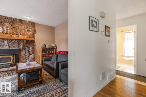3959 55 Street, Edmonton, AB - Indoor Photo Showing Living Room With Fireplace