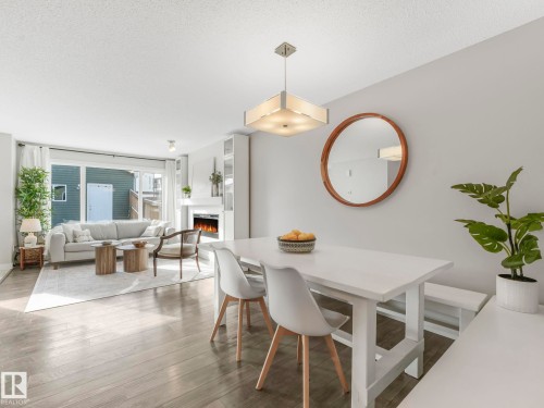 2604 Coughlan Road, Edmonton, AB - Indoor Photo Showing Dining Room With Fireplace