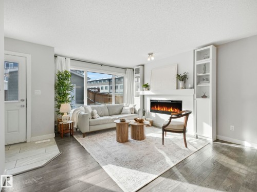 2604 Coughlan Road, Edmonton, AB - Indoor Photo Showing Living Room With Fireplace