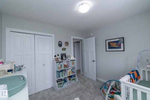 This room features light grey walls, white trim, and light-colored carpet - 20650 94A Avenue, Edmonton, AB - Indoor Photo Showing Bedroom