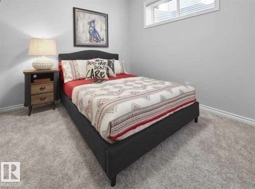 Bedroom featuring light grey walls, light grey carpet, and a window with white blinds - 20650 94A Avenue, Edmonton, AB - Indoor Photo Showing Bedroom