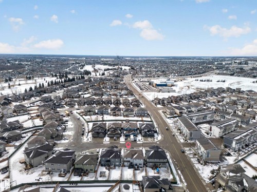 Aerial view of the property and its surrounding neighbourhood, featuring paved roads and houses with varying roof styles - 20650 94A Avenue, Edmonton, AB - Outdoor With View