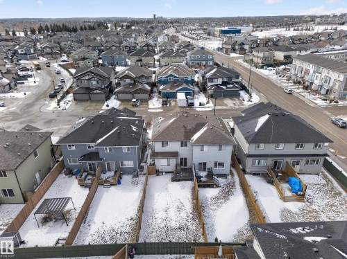 The property features a spacious backyard with a deck and a fenced perimeter - 20650 94A Avenue, Edmonton, AB - Outdoor With View