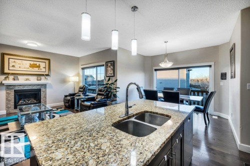 3671 8 Street, Edmonton, AB - Indoor Photo Showing Kitchen With Fireplace With Double Sink