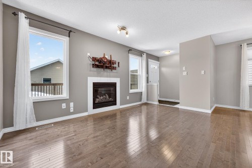 21406 94A Avenue, Edmonton, AB - Indoor Photo Showing Living Room With Fireplace