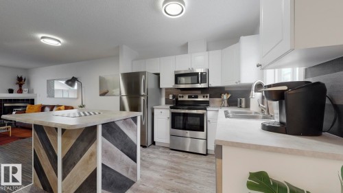 52 10909 106 Street, Edmonton, AB - Indoor Photo Showing Kitchen With Stainless Steel Kitchen With Double Sink