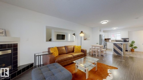 52 10909 106 Street, Edmonton, AB - Indoor Photo Showing Living Room With Fireplace
