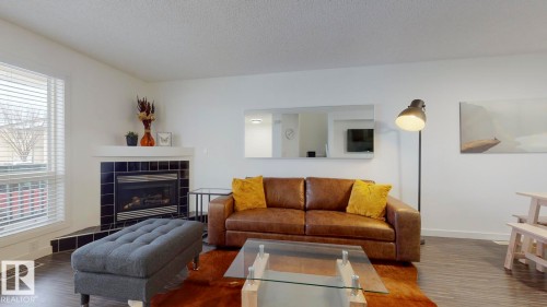52 10909 106 Street, Edmonton, AB - Indoor Photo Showing Living Room With Fireplace