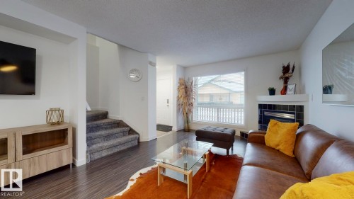 52 10909 106 Street, Edmonton, AB - Indoor Photo Showing Living Room With Fireplace