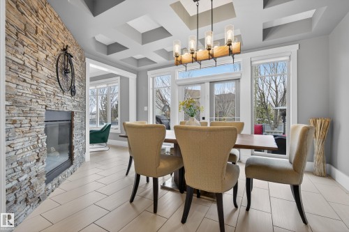 2003 Ainslie Link Link, Edmonton, AB - Indoor Photo Showing Dining Room With Fireplace