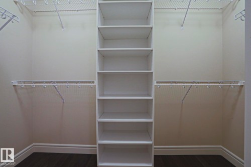 The property features a spacious closet with built-in shelving and wire racks for organized storage - 2315 Ashcraft Cape, Edmonton, AB - Indoor With Storage