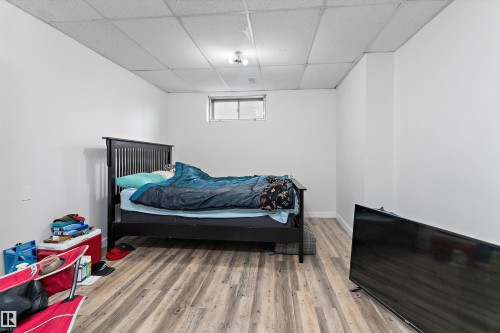 Basement bedroom 11'3" x18'3" - 6103-6105 97A Avenue, Edmonton, AB - Indoor Photo Showing Bedroom