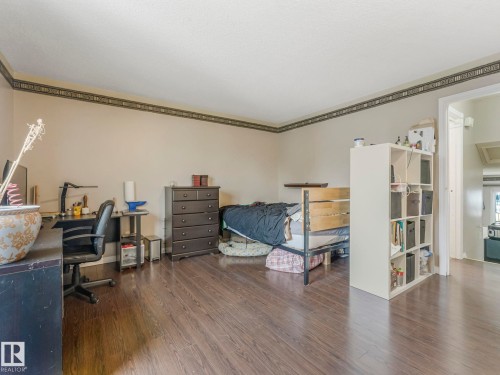 This room features hardwood flooring and light-colored walls, providing a neutral canvas - 4105 41 Avenue, Edmonton, AB - Indoor