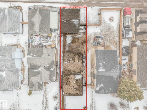 Aerial view showcasing the property's footprint, surrounded by neighboring homes and visible streets - 4105 41 Avenue, Edmonton, AB - 
