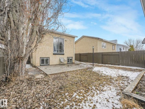 The property features a backyard with a wooden deck and a fence - 4105 41 Avenue, Edmonton, AB - Outdoor