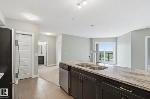 511 1230 Windermere Way, Edmonton, AB - Indoor Photo Showing Kitchen With Double Sink
