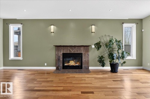 1004 Downey Way, Edmonton, AB - Indoor Photo Showing Living Room With Fireplace