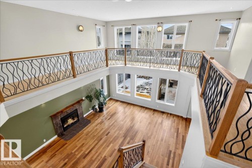 1004 Downey Way, Edmonton, AB - Indoor Photo Showing Other Room With Fireplace