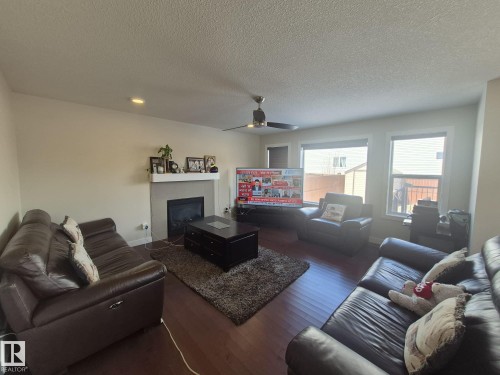 3308 18B Avenue, Edmonton, AB - Indoor Photo Showing Living Room With Fireplace