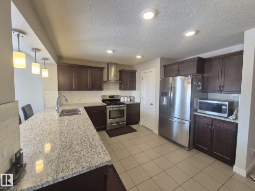 3308 18B Avenue, Edmonton, AB - Indoor Photo Showing Kitchen With Double Sink