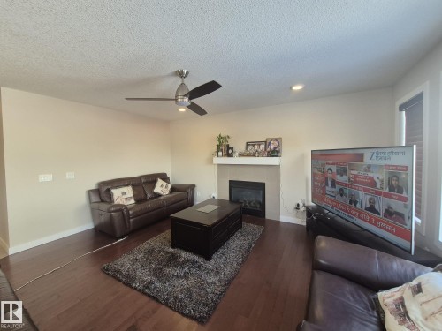 3308 18B Avenue, Edmonton, AB - Indoor Photo Showing Living Room With Fireplace