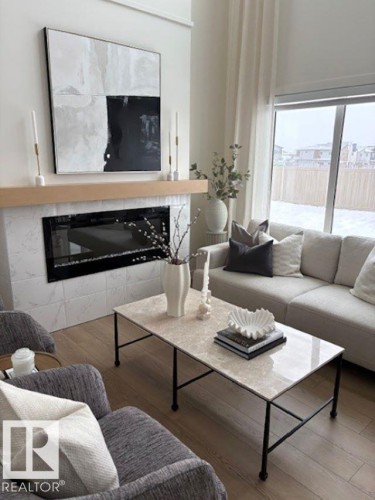 5039 Cawsey Link, Edmonton, AB - Indoor Photo Showing Living Room With Fireplace