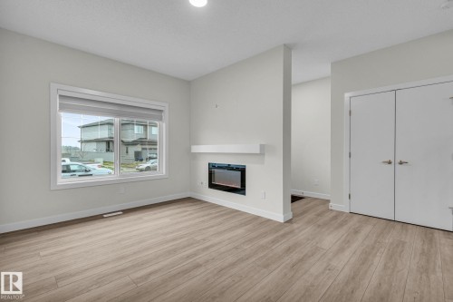 307 Brae Way, Leduc, AB - Indoor Photo Showing Other Room With Fireplace