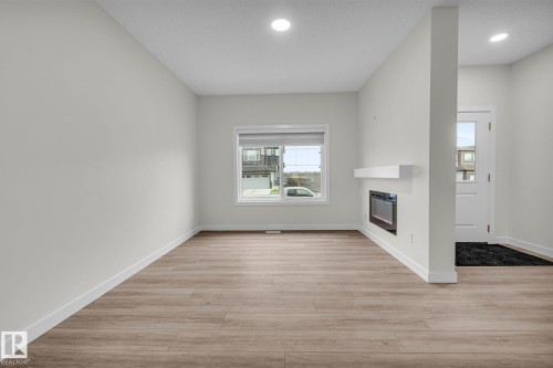 307 Brae Way, Leduc, AB - Indoor Photo Showing Other Room With Fireplace