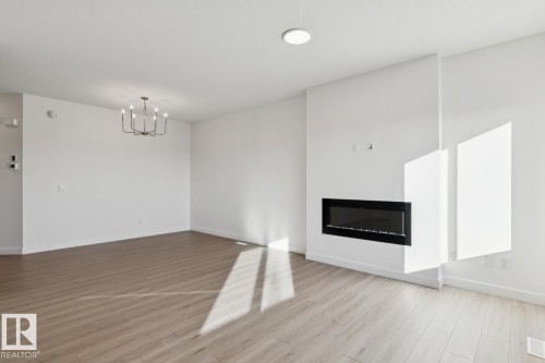 4568 Chegwin Wynd, Edmonton, AB - Indoor Photo Showing Living Room With Fireplace