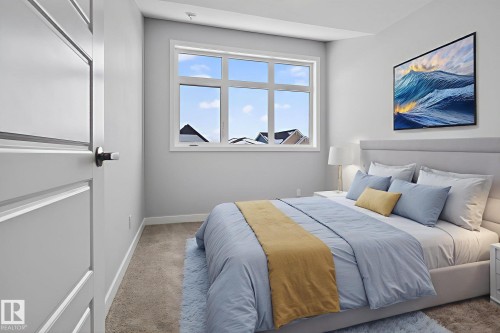 This room features a window providing natural light, light-colored walls, and carpeting - 3230 Parker Loop, Edmonton, AB - Indoor Photo Showing Bedroom