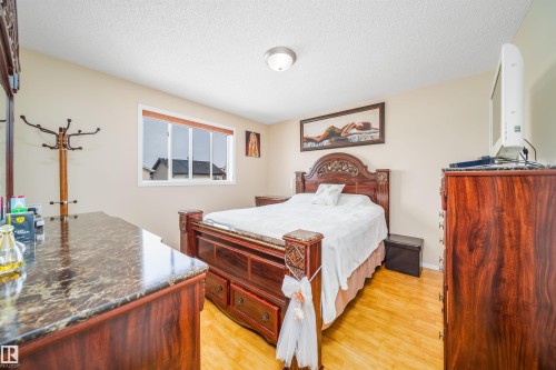 The room features light-colored walls and light wood flooring - 8932 175 Avenue, Edmonton, AB - Indoor Photo Showing Bedroom